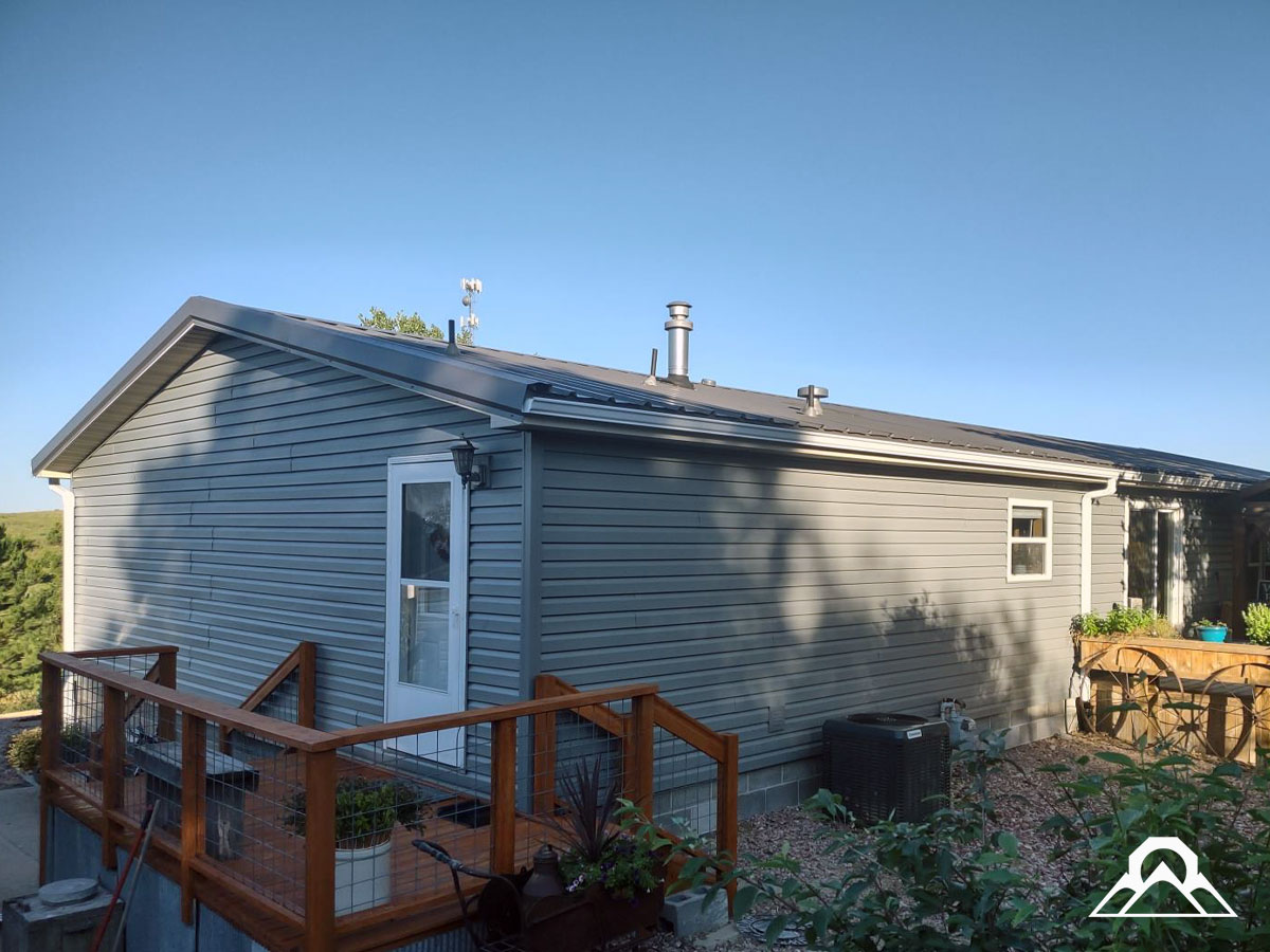 residential-Project_6_roof-replacement_new_metal_roof_gutters_downspouts_siding_windows_after_2