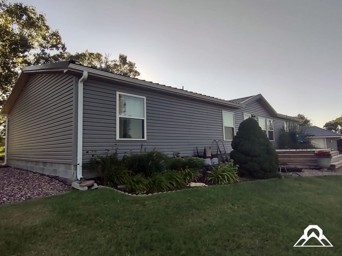 residential-Project_6_roof-replacement_new_metal_roof_gutters_downspouts_siding_windows_after_6